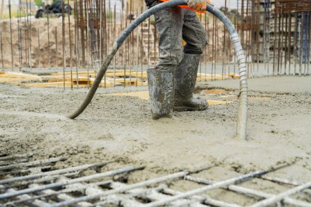 construction-worker-pouring-concrete-at-concreting-2025-01-10-15-10-27-utc-1536x1024.jpg
