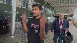 Illegal migrant flips the bird after arrest for attacking NYPD officers